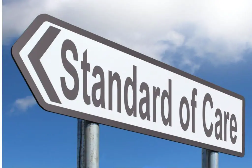 road sign with the words : standard of care" 
