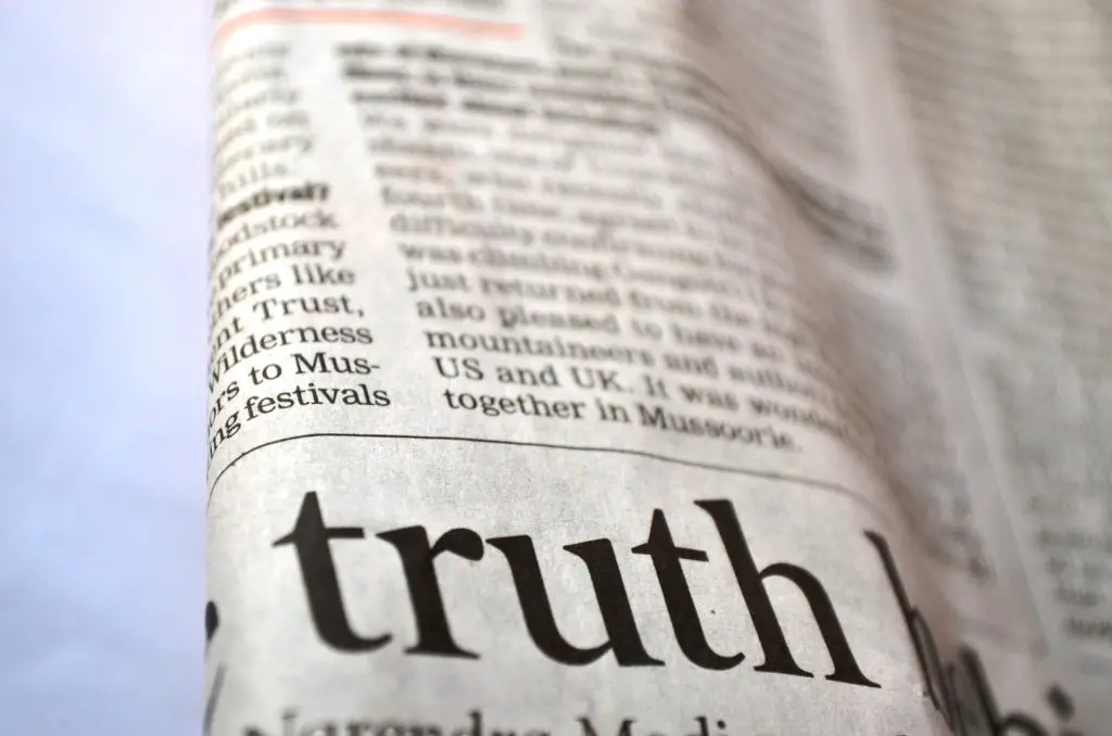 folded newspaper with the word "truth" displayed prominently