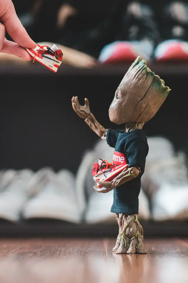 a movie character from "guardians of the galaxy" receiving a shoe